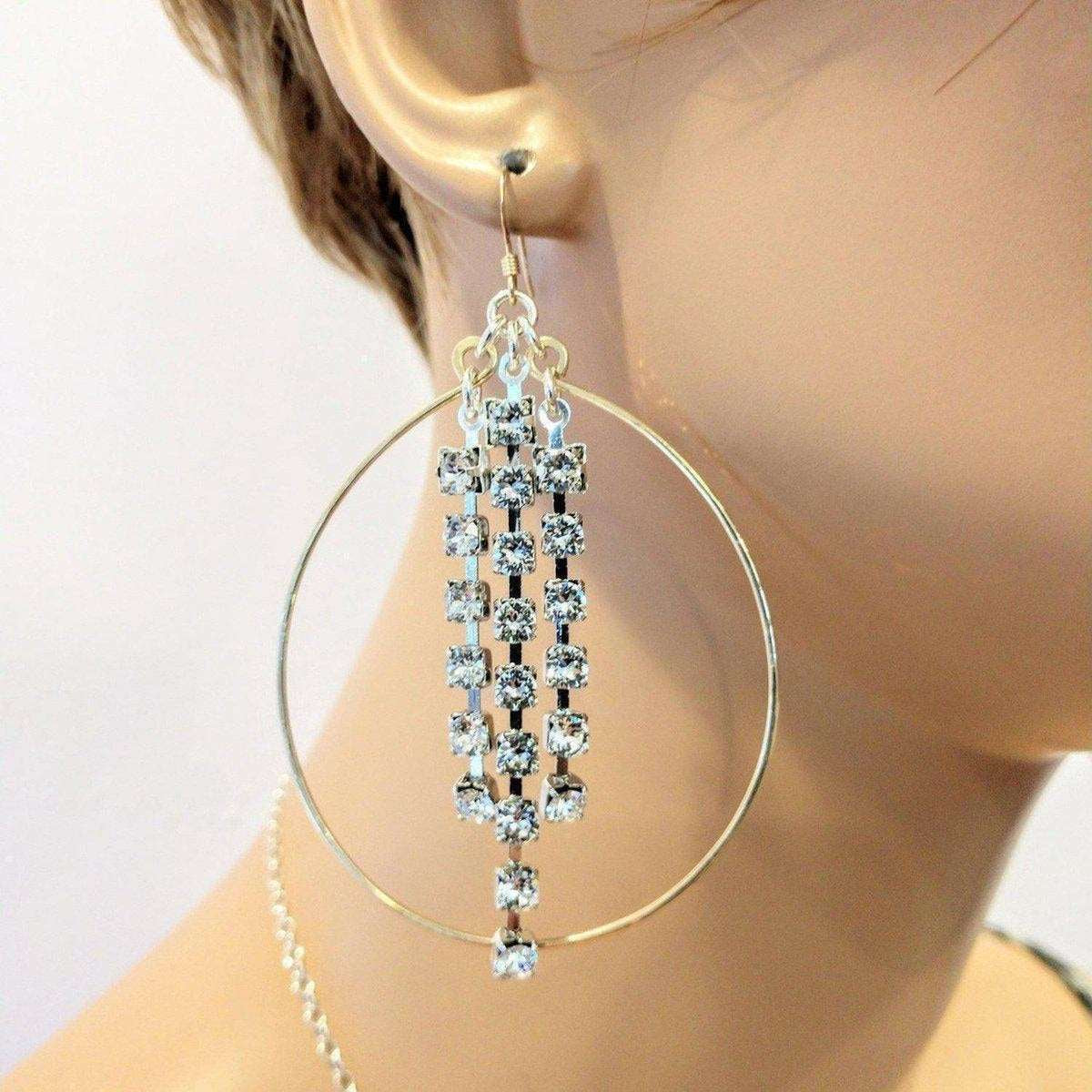 Elegant Crystal-Linked Oval Hoop Earrings in Gold