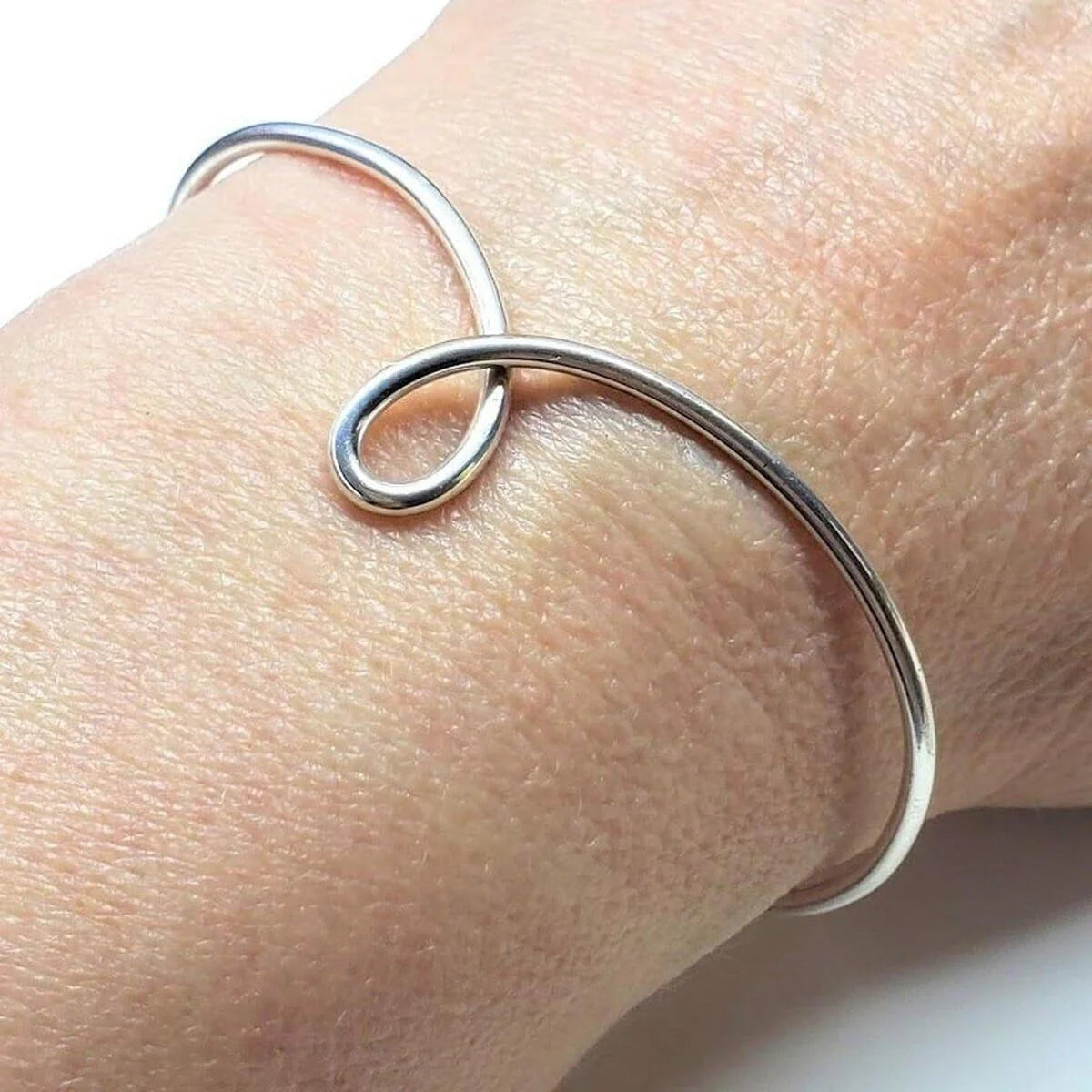 Everlasting Elegance Silver Dual-Sided Teardrop Tribute Bangle 